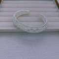 Detailed view of silver open cuff bracelet featuring an intricate hollow lattice mesh pattern - Bangle / Silver