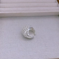 Close-up of adjustable silver open ring featuring a sophisticated hollow mesh texture - Wide Band Ring / Silver