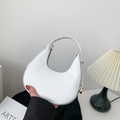 White faux crocodile hobo bag with gold hardware detail and minimalist crescent shape - White