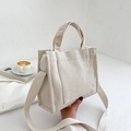 Minimalist cream corduroy tote bag with front pocket and adjustable shoulder strap - White