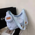 Light blue woven hobo bag with wide shoulder strap and round coin purse charm - Blue
