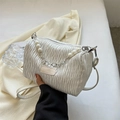 White pleated cylinder crossbody bag featuring pearl chain and fashion label detail - White
