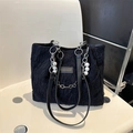Black lace tote bag with floral texture, silver chain strap and decorative white pearls - Black