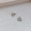 Detail view of heart stud earrings with hammered texture and 18k gold plated finish - Silver Lava Hammered Style / Silver