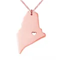 Macro view of rose gold Maine state map pendant with a delicate hollow heart detail - Rose Gold