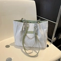 White pleated tote bag with green leather trim and elegant pearl chain accessory - White