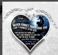 Macro detail of silver heart pendant with father and daughter silhouette and emotional text - New Dad and Child