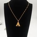 Detail of 18K gold plated letter A pendant with textured finish on a neck mannequin - Capital Letter A