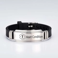 Detail of medical alert bracelet with black silicone strap and heart condition engraving - Silver / Heart Disease