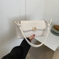 Quilted white crossbody bag with gold buckle and knotted leather shoulder strap - White