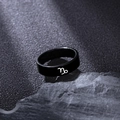 Matte black stainless steel ring featuring a white Capricorn zodiac symbol on a rock - Capricorn