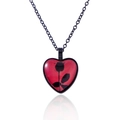 Close-up of heart-shaped pendant with red background and black rose silhouette pattern - Black