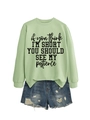 Detailed view of casual mint green sweatshirt with fun quote and distressed denim shorts - Olive Green (Black Font)