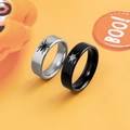 Halloween spider and web stainless steel couple rings set against an orange background - Spider and Spider Web Couple Rings (Set of 2)
