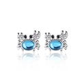 Detail of silver crab earrings featuring blue crystal centers and sparkling accents - Blue Crab Style / Silver/Blue