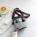 Ethnic style bucket bag with blue and beige weaving and colorful tassel accents - Blue