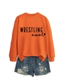 Detail showing orange crewneck sweatshirt with Wrestling Aunt print and denim shorts - Orange Sweatshirt (Black Font)