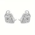 Polished silver girl hugging dog stud earrings showing metallic texture and details - Silver Needle