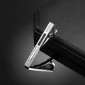 Close-up of silver men's tie clip with black enamel inlay and three vertical zircons - Silver