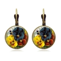 Macro detail of bronze floral earrings with pansy pattern under glass cabochon - Multicolor Pansy