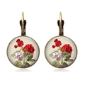 Close-up of vintage bronze rose earrings with floral glass cabochon and lever-back hooks - Red and White Geranium