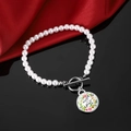 Detail of pearl bracelet with OT clasp and floral 'It is well with my soul' charm - It Is Well With My Soul Inspirational Style