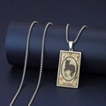 Detailed view of silver stainless steel The World tarot card pendant with black cat design - The World