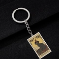 Detail of The Magician tarot keychain featuring a black cat and silver stainless steel ring - The Magician