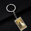 Detail of The Lovers tarot cat keychain in silver finish showing intricate cat artwork - The Lovers