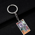 Macro detail of The Magician tarot keychain with colorful Halloween oil painting graphics - Magician