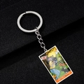 Macro view of Tarot The Moon pendant keychain with colorful Halloween pumpkin detail - Moon