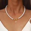 Lustrous pearl necklace featuring a gold OT clasp and micro-pave letter K pendant - Gold K