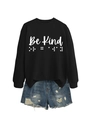 Detail of Be Kind text and braille print on casual black sweatshirt and denim shorts - Black (White Font)