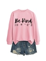 Detail of pink crewneck sweatshirt with Be Kind text and braille over denim shorts - Pink (Black Text)