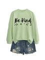 Detail of mint green Be Kind crewneck sweatshirt with braille text design and denim shorts - Olive Green (Black Font)