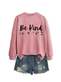 Close-up of pink sweatshirt featuring black Be Kind braille font print and denim shorts - Rose Gold (Black Font)