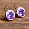 Detail of Halloween drop earrings with ghost and pumpkin charms on vintage wood - Trick or Treat Illustration Style (Style-10)