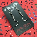 Gothic silver scythe pendant earrings with skulls on a red bat themed display card - Scythe