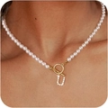 Lustrous pearl necklace featuring a gold OT clasp and a sparkling pavé diamond U pendant - Gold U