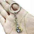 Polished silver girl hugging a golden dog pendant earring keychain in hand - Keychain