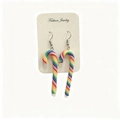 Close-up of rainbow polymer clay candy cane earrings on a white display card - Rainbow Stripe Style
