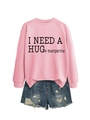 Detailed view of pink cotton sweatshirt with 'I NEED A HUGe margarita' slogan and denim shorts - S / Black Font / Pink