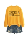 Flat lay of yellow casual sweatshirt with I NEED A HUGe margarita print and ripped denim shorts - S / Black Font / Yellow