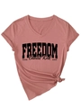 Close-up of pink V-neck T-shirt detail showing the knotted hem and Freedom text print - Pink