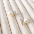 Elegante zilveren pareloorbellen met ronde witte parels en sprankelende zirkonia-steen - Wit (12mm)