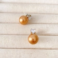 Champagne pareloorknoppen met zirkonia steentjes op een zilveren metalen basis - Goud (12mm)