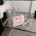 Mini borsa a tracolla rosa con fiocco decorativo e manico rotondo in ecopelle - Rosa