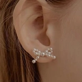 Elegante witte pareloorbellen met strikje voor dames met fijn parelweefsel en 925 zilveren pin - Strikje Parel Oorbellen