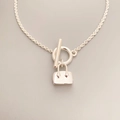 Detailed macro view of minimalist handbag pendant necklace with silver OT clasp buckle - Bag Style (Approx. 45cm)