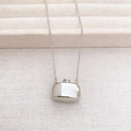 Detailed close-up of a silver flask-shaped perfume bottle pendant on an O-chain necklace - Bottle Style (Approx. 46cm)